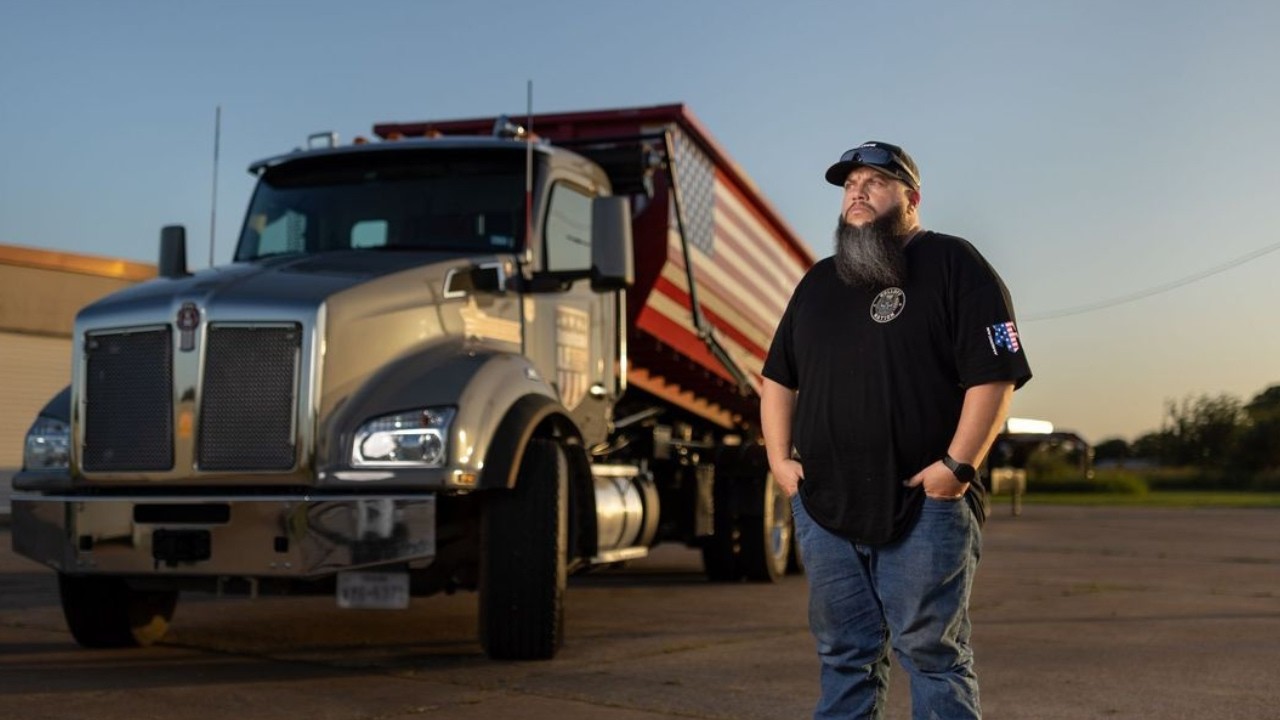 Josh Roman, Founder of Dumpster Expo, with his American AF dump truck